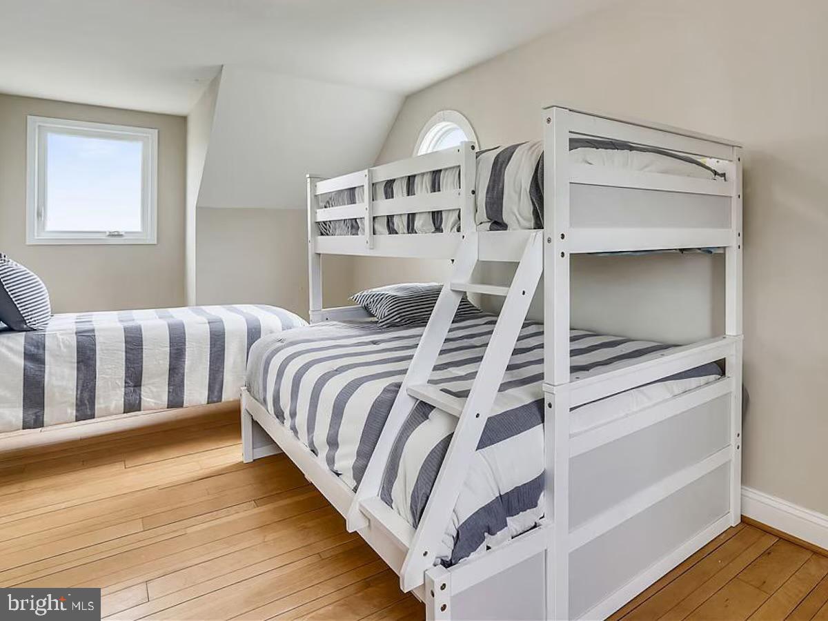 21642 Chicken Point Road Tilghman, MD 21671 - Photo 50 of 63 a bedroom with a bed and a window
