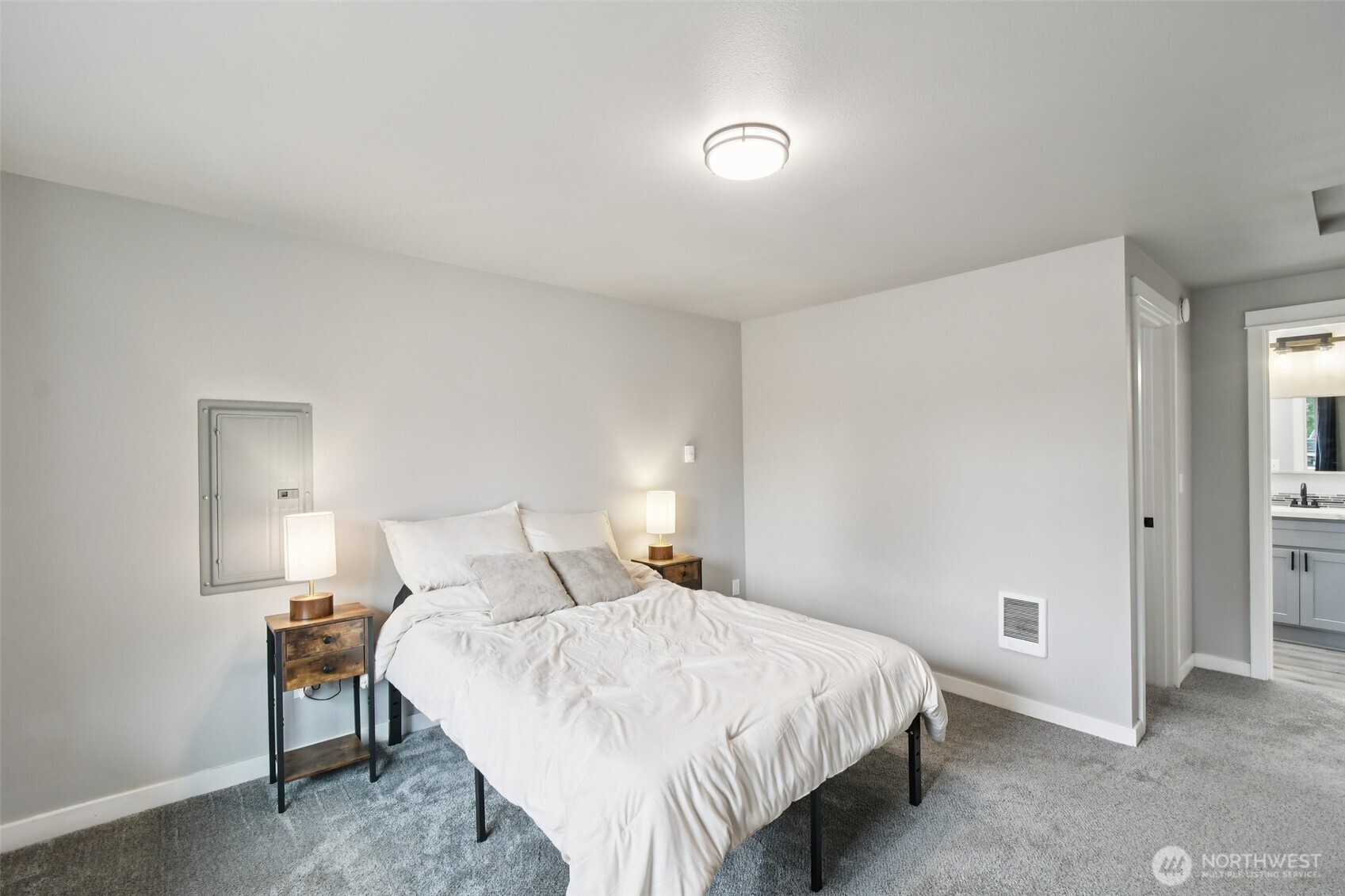 429 Fir Street McCleary, WA 98557 - Photo 12 of 21 a bedroom with a bed and a lamp