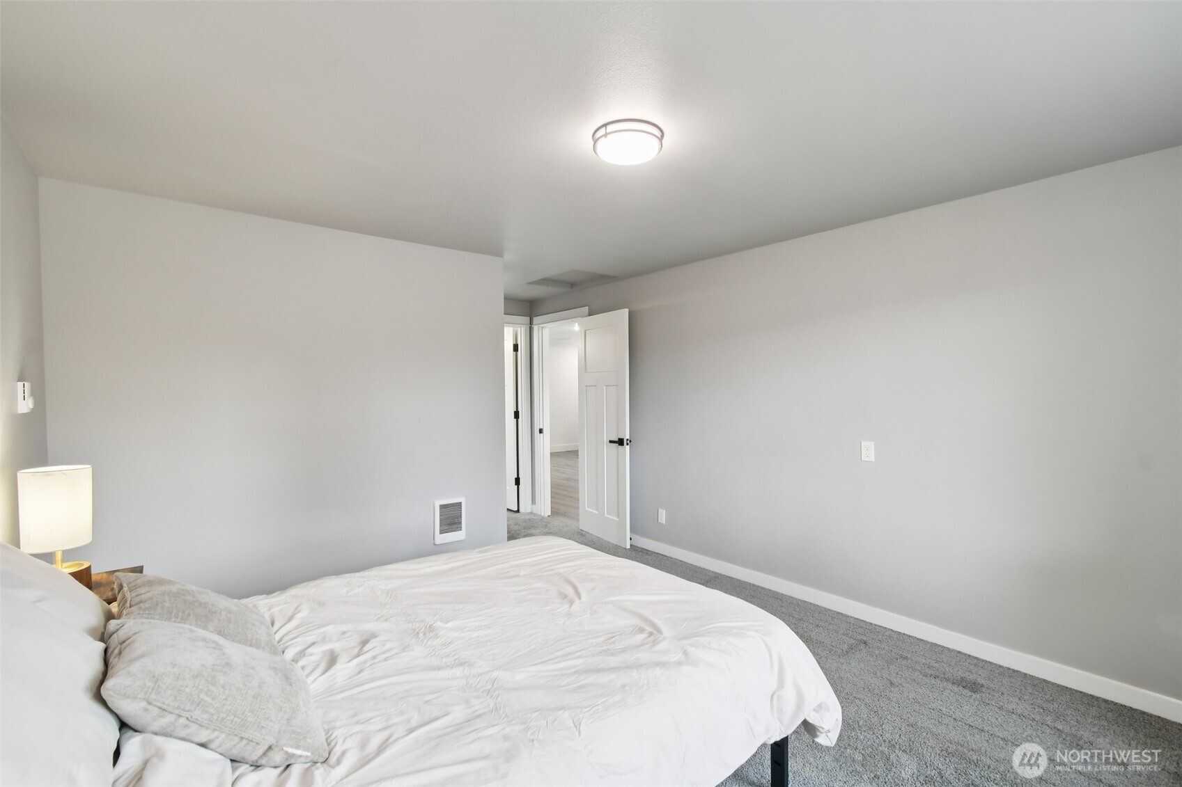 429 Fir Street McCleary, WA 98557 - Photo 14 of 21 a bedroom with a bed and a lamp