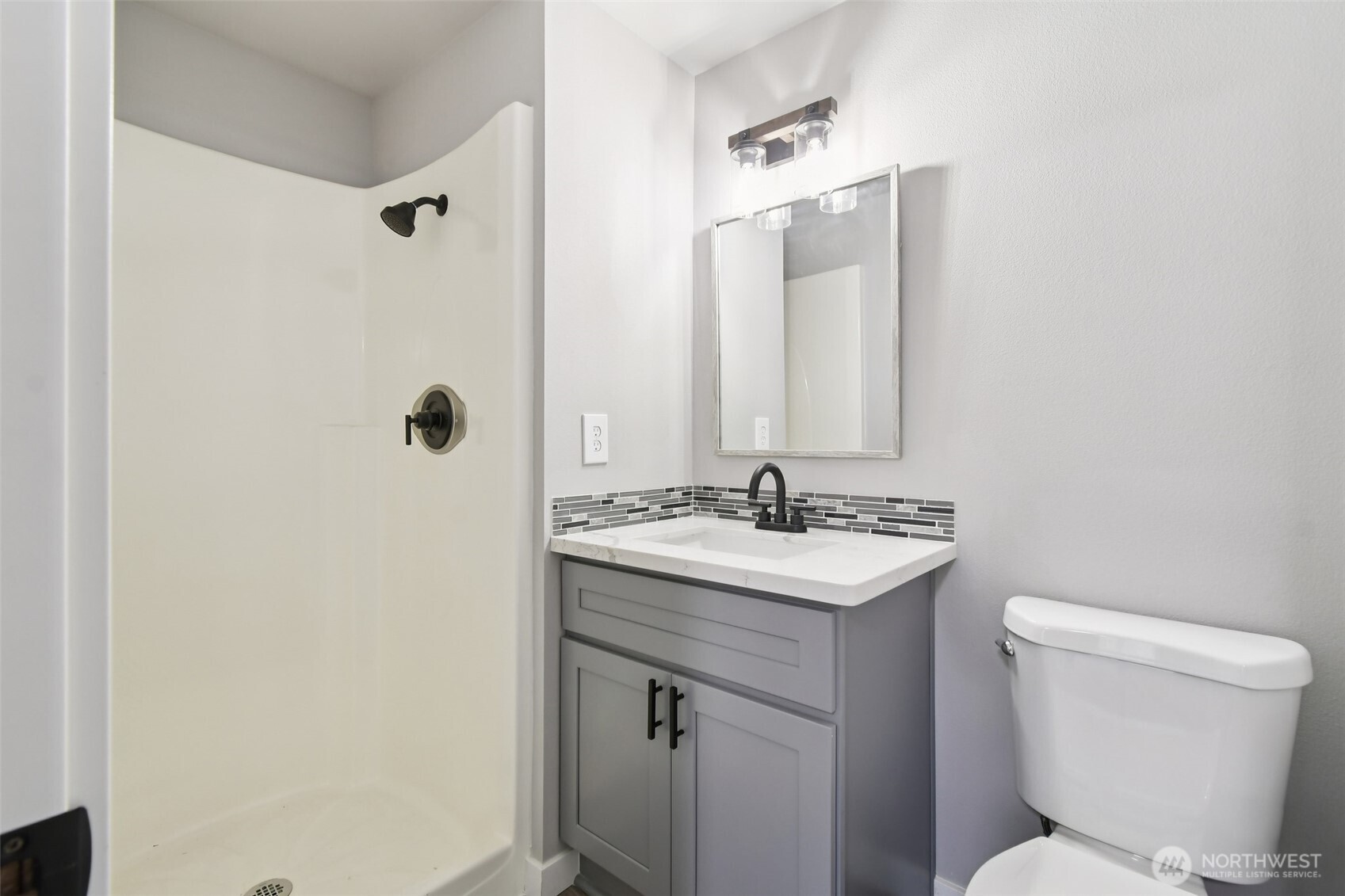 429 Fir Street McCleary, WA 98557 - Photo 20 of 21 a bathroom with a toilet sink and mirror