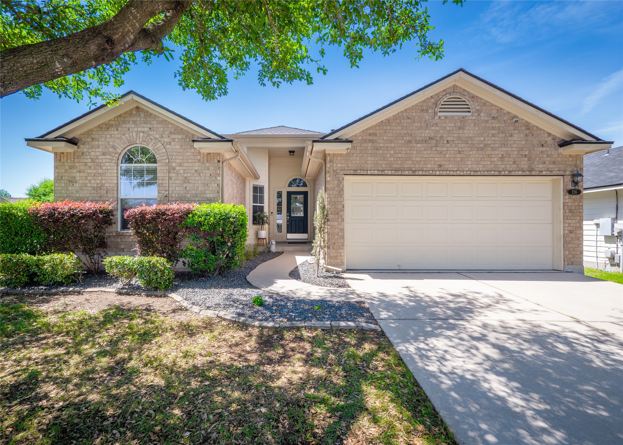 236 Pentire Way Hutto, TX 78634 - Photo 1 of 1 a front view of a house with garden