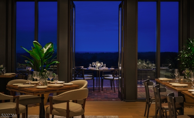43 Abby Road Peapack, NJ 07977 - Photo 12 of 25 a view of a dining room with furniture and chandelier