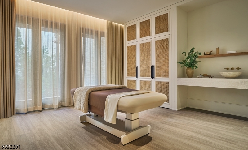 43 Abby Road Peapack, NJ 07977 - Photo 15 of 25 a bedroom with a bed and wooden floor