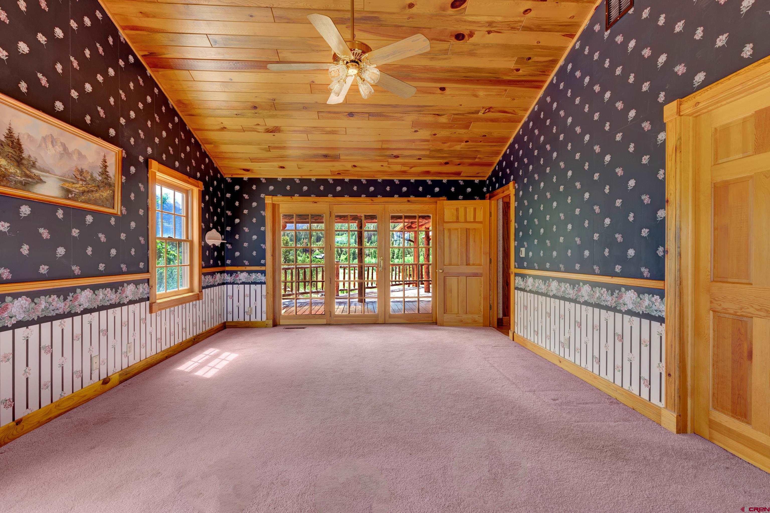 2692 County Road 17 Ridgway, CO 81432 - Photo 20 of 38 a view of a porch with wooden floor and iron stairs