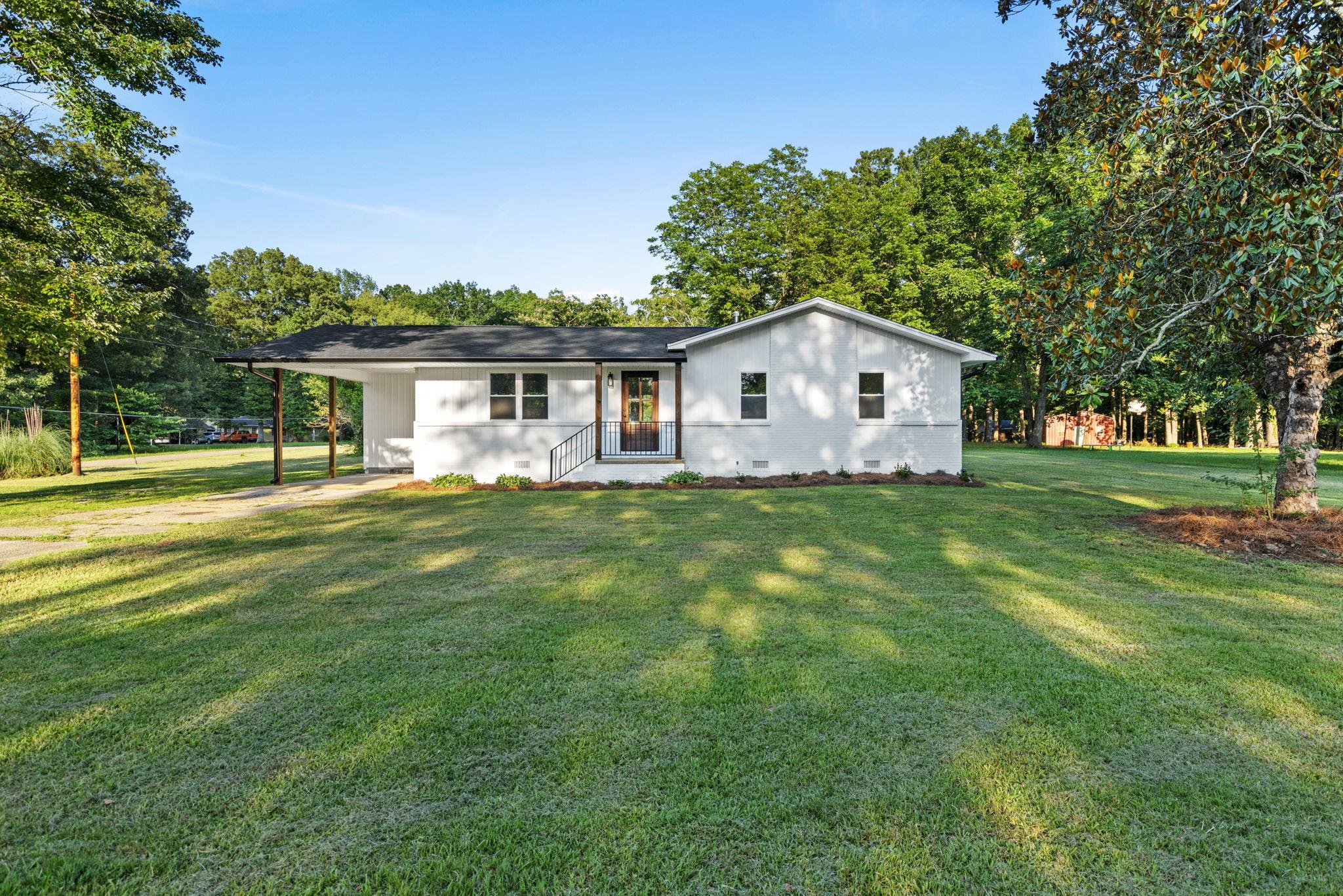 17 County Road 233 Corinth, MS 38834 - Photo 1 of 40 View of front of home with a front lawn, a carport, and crawl space