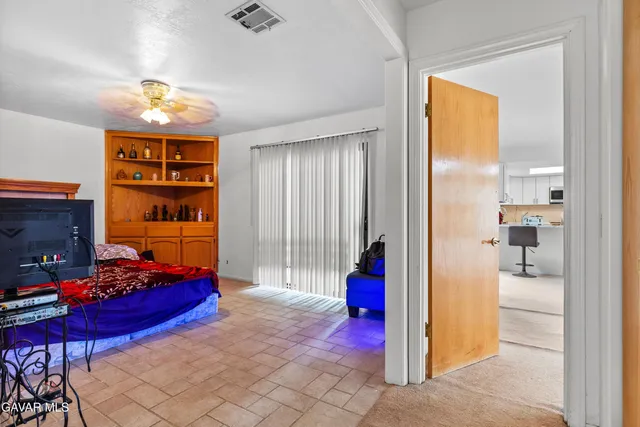 a bedroom with furniture and a chandelier