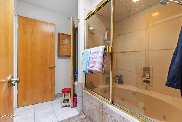 a bathroom with a bathtub and shower