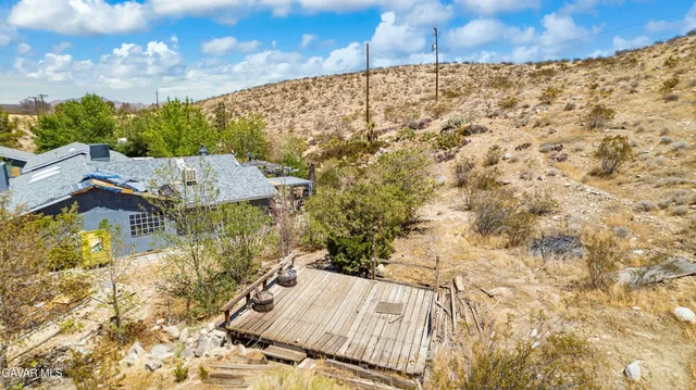 a view of backyard with cabin