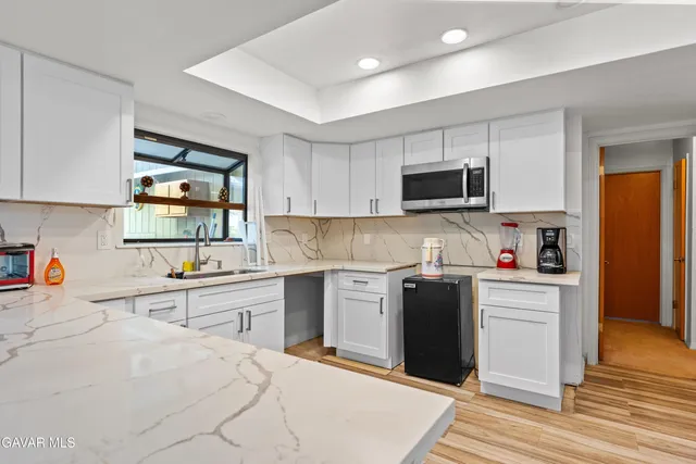 a kitchen with a stove and a sink