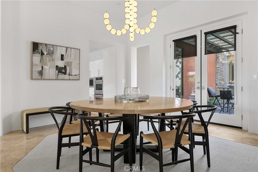 50070 Vía De Moda La Quinta, CA 92253 - Photo 11 of 32 a view of a dining room with furniture window and wooden floor