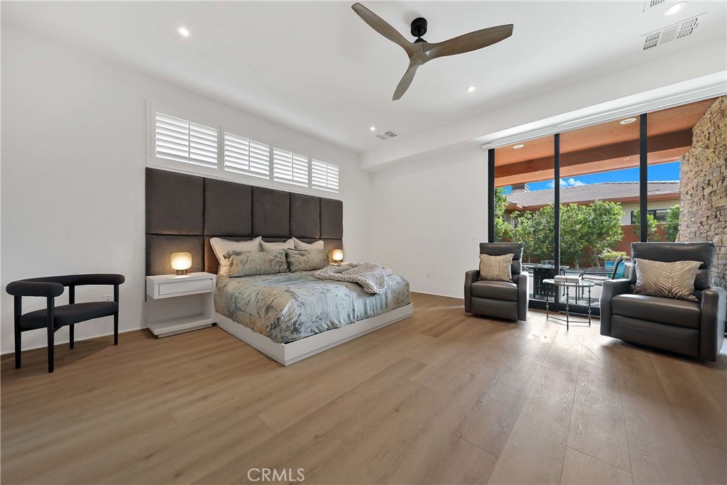 50070 Vía De Moda La Quinta, CA 92253 - Photo 13 of 32 a bedroom with a bed and a couch