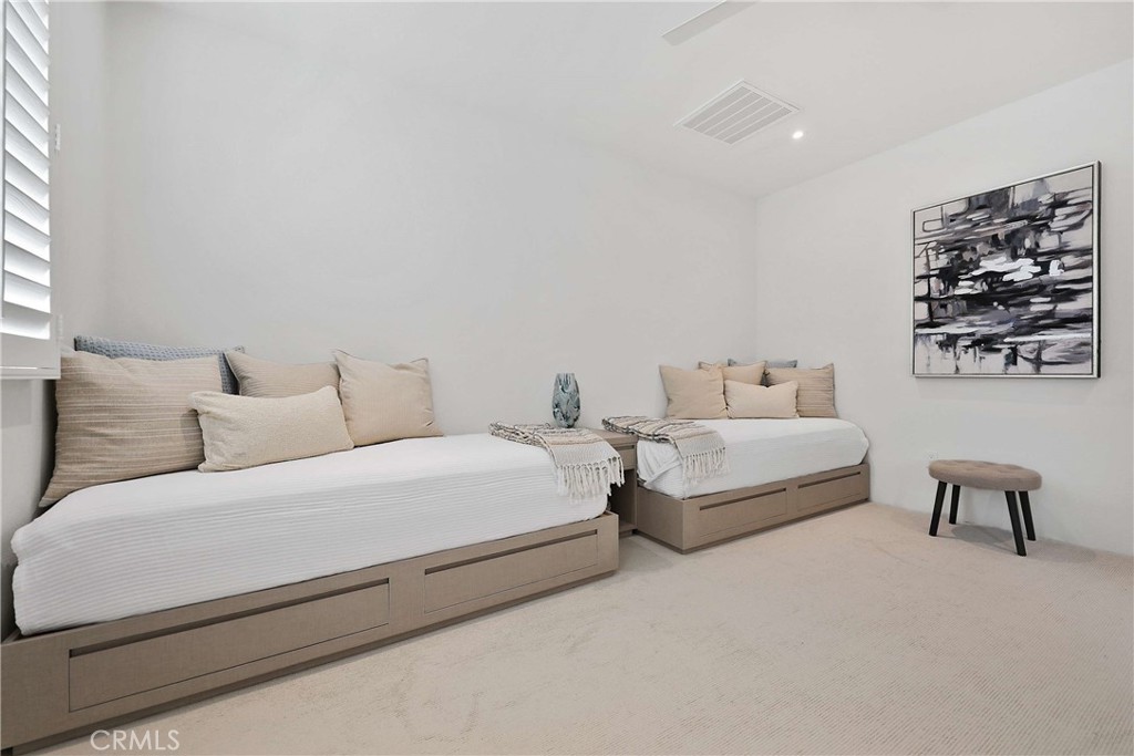 50070 Vía De Moda La Quinta, CA 92253 - Photo 15 of 32 a bedroom with bed and a couch