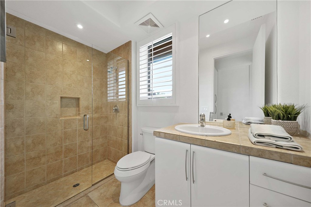 50070 Vía De Moda La Quinta, CA 92253 - Photo 16 of 32 a bathroom with a sink a toilet and shower