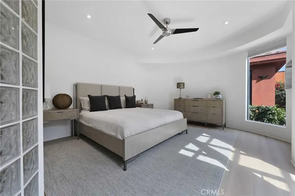 a bed room with a bed and a window