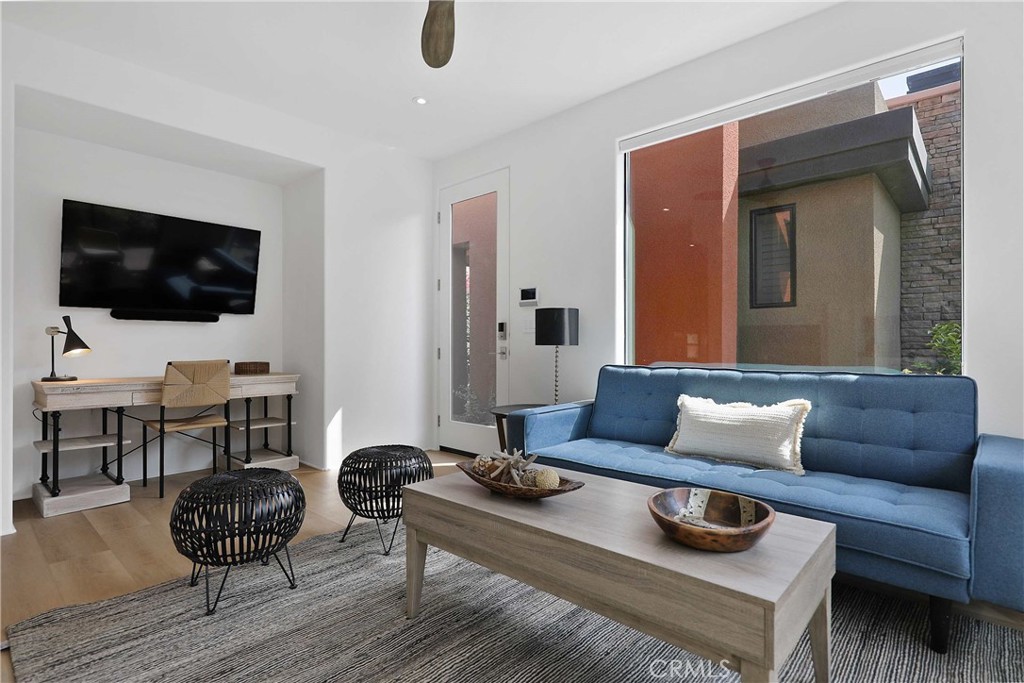 50070 Vía De Moda La Quinta, CA 92253 - Photo 18 of 32 a living room with furniture and a flat screen tv