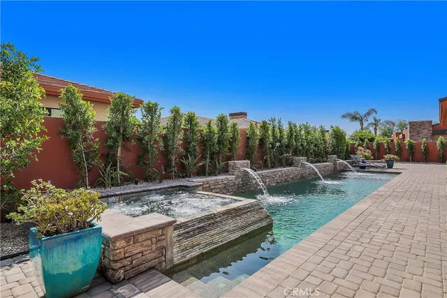 a view of a backyard with sitting area
