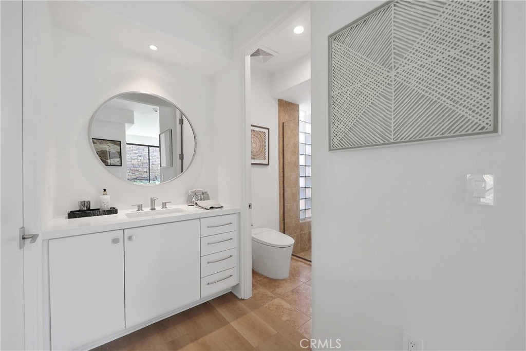 50070 Vía De Moda La Quinta, CA 92253 - Photo 21 of 32 a bathroom with a toilet sink and mirror