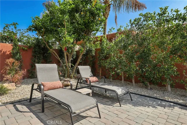 a view of a chairs and table in the patio