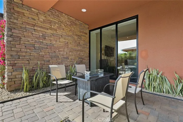 a outdoor space with a couch and chairs