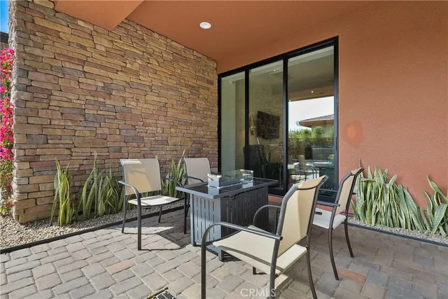 a outdoor space with a couch and chairs