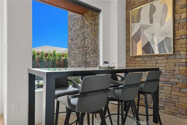 a view of a table and chairs in the balcony