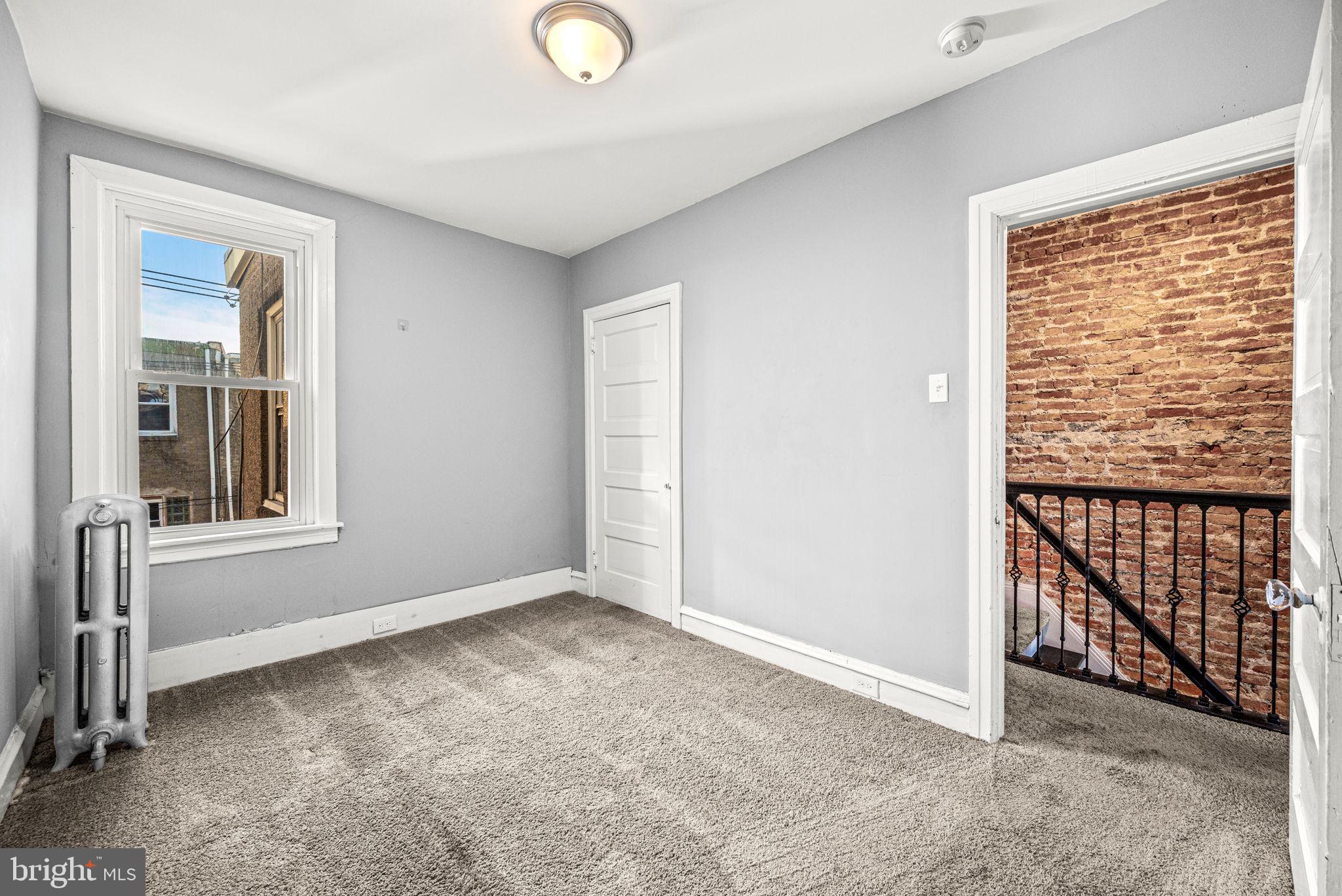 5426 Windsor Street Philadelphia, PA 19143 - Photo 11 of 22 an empty room with windows