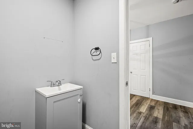a bathroom with a sink and vanity