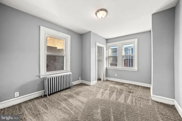 an empty room with windows