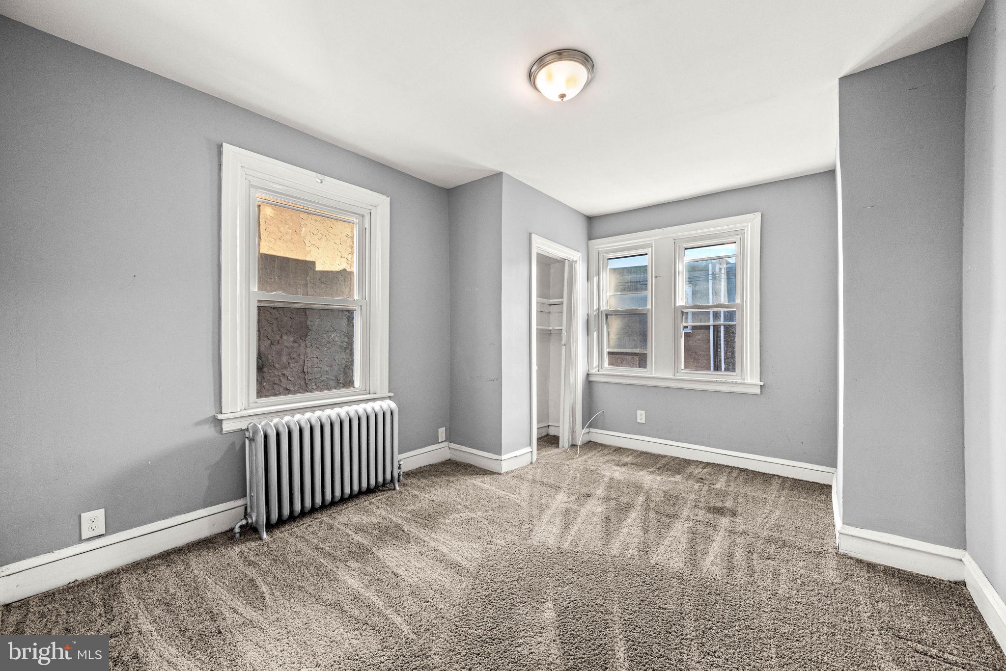 5426 Windsor Street Philadelphia, PA 19143 - Photo 10 of 22 an empty room with windows