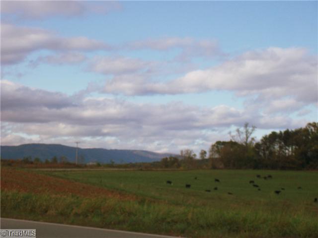 View. Picture taken from front yard looking across the road at cattle grazing in the field and to the beautiful mountain view.