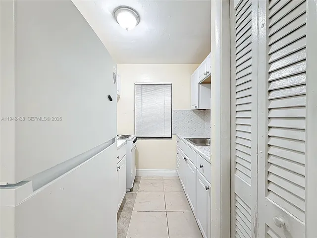 a bathroom with a double vanity sink and mirror