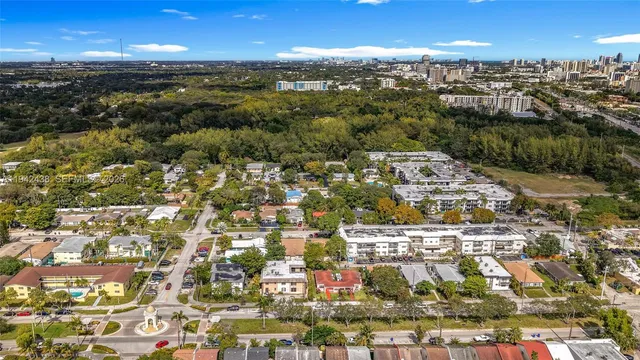 an aerial view of residential building with parking
