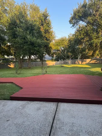 a small yard with wooden fence