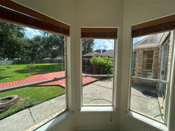a large kitchen with a stove a sink and a refrigerator