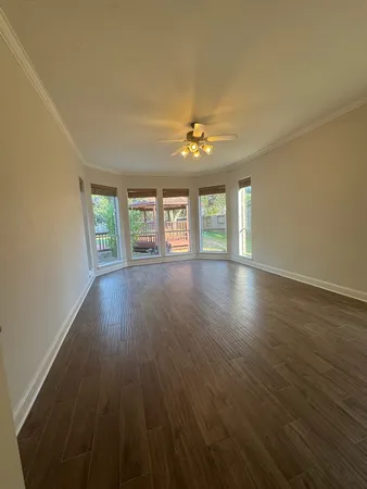a open kitchen view with the stainless steel appliances granite countertop cabinets and chandelier