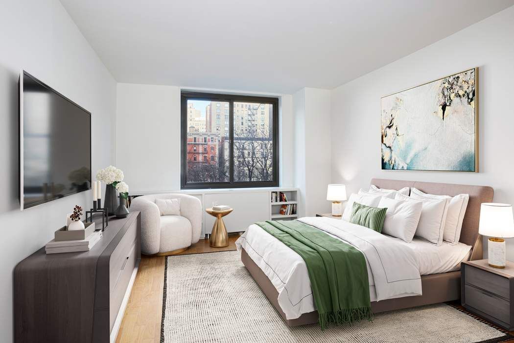 40 East 94th Street, Unit 3D Manhattan, NY 10128 - Photo 2 of 5 a bedroom with a beds and a couch