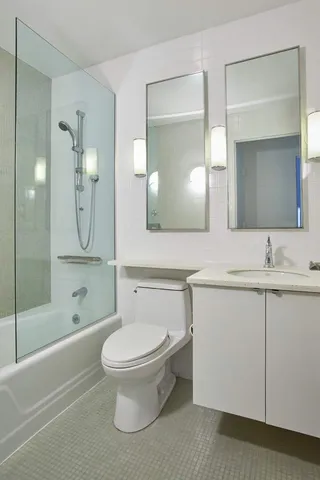 a kitchen with stainless steel appliances granite countertop a stove and a microwave