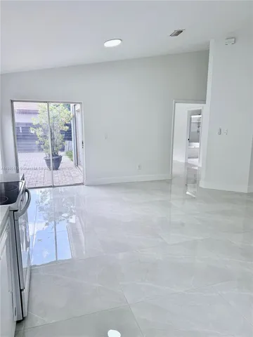 a view of empty room with large window