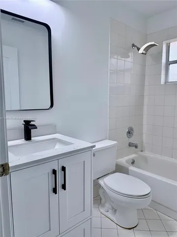 a view of an empty room with a floor to ceiling window