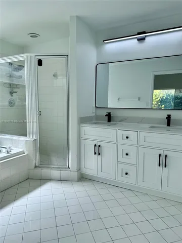 a bathroom with a bathtub and a shower