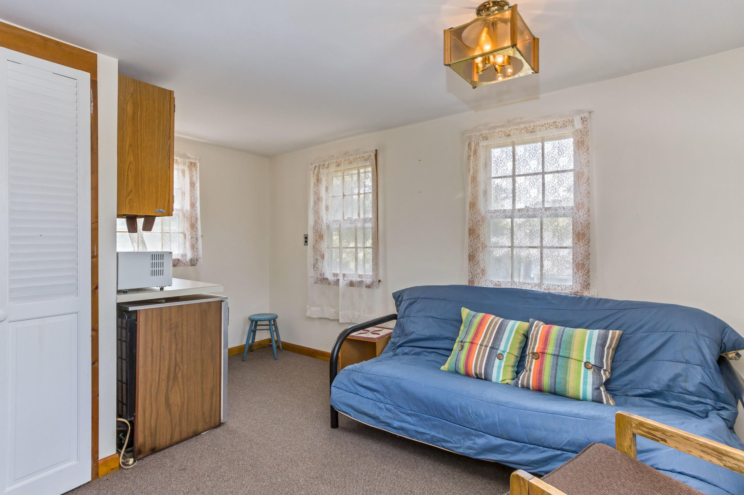 77 Susan Ruth Road Dennis Port, MA 02639 - Photo 14 of 25 a living room with furniture and a window