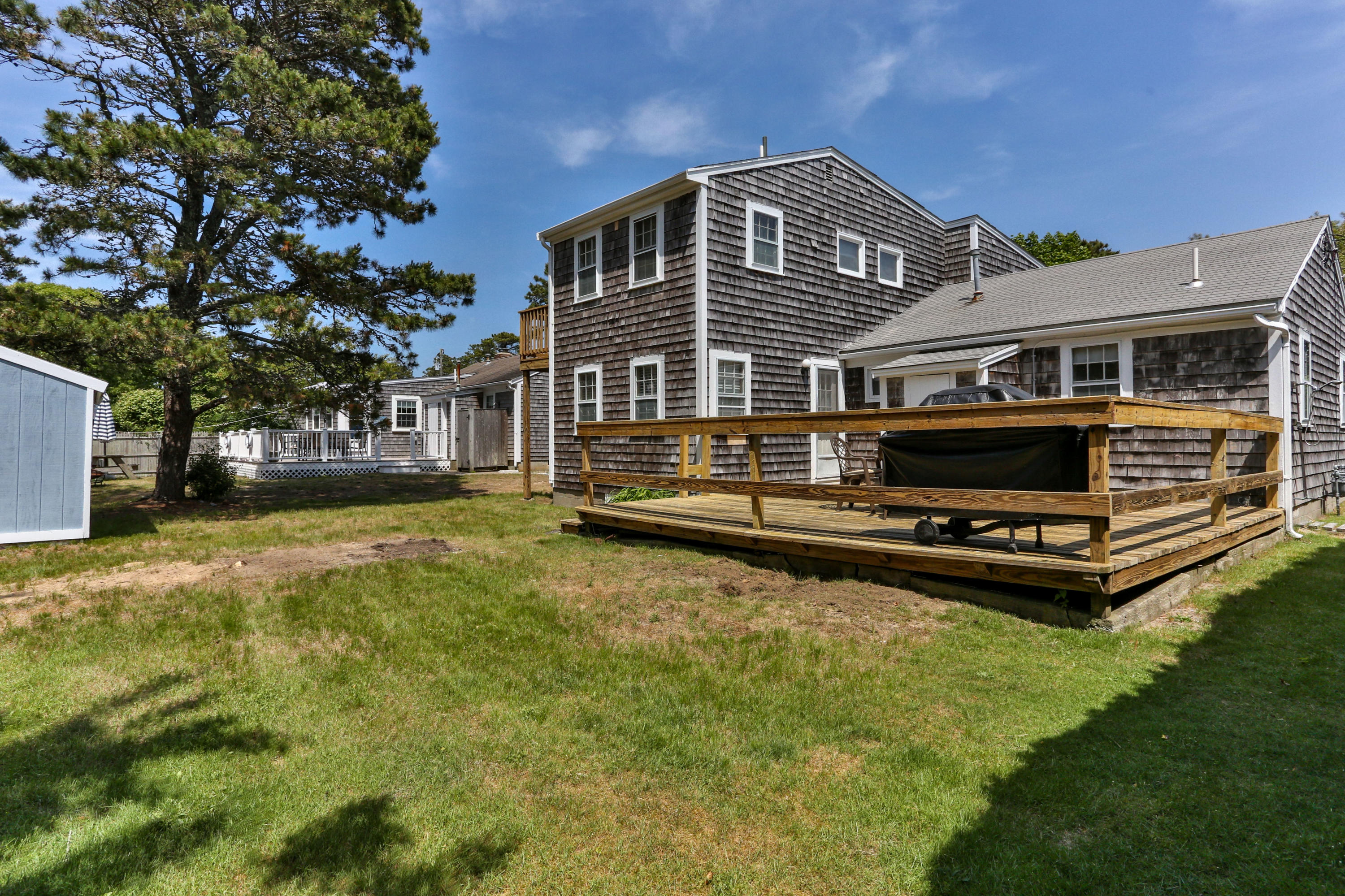 77 Susan Ruth Road Dennis Port, MA 02639 - Photo 22 of 25 a front view of a house with a yard