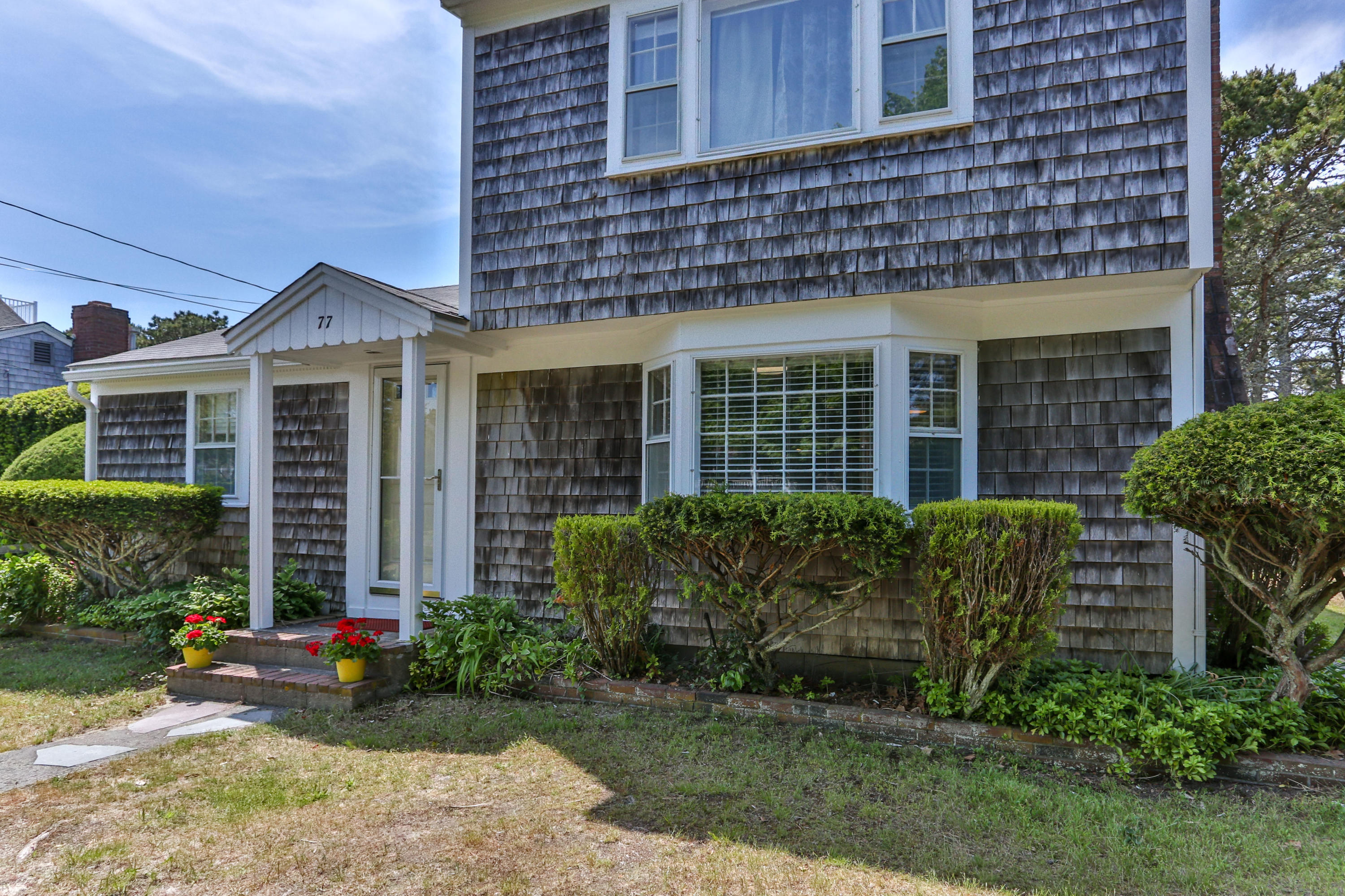 77 Susan Ruth Road Dennis Port, MA 02639 - Photo 3 of 25 a front view of a house with garden