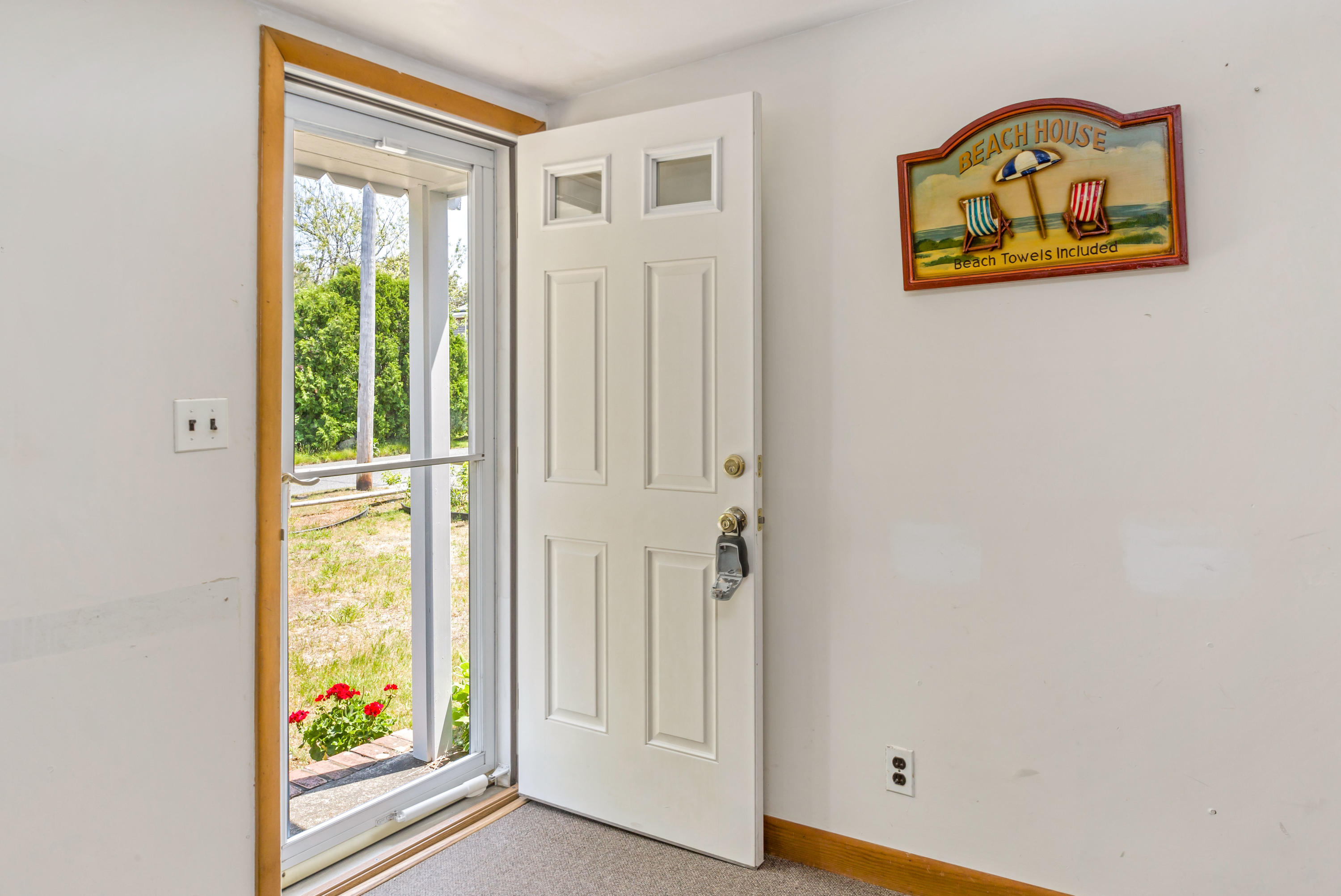 77 Susan Ruth Road Dennis Port, MA 02639 - Photo 4 of 25 an entryway with wooden floor and a window