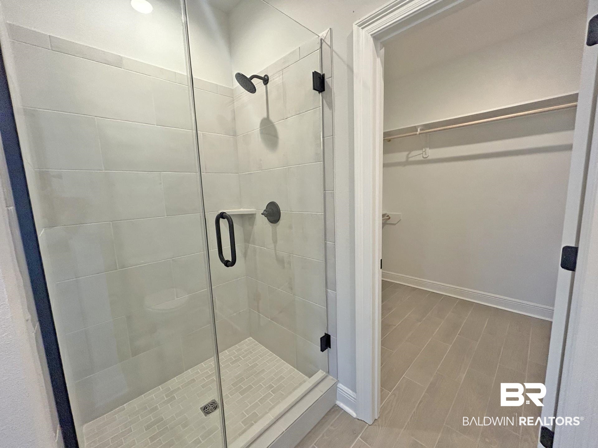 1748 Breckinridge Place Foley, AL 36535 - Photo 17 of 25 Full bath with a walk in closet, a shower stall, and wood finish floors