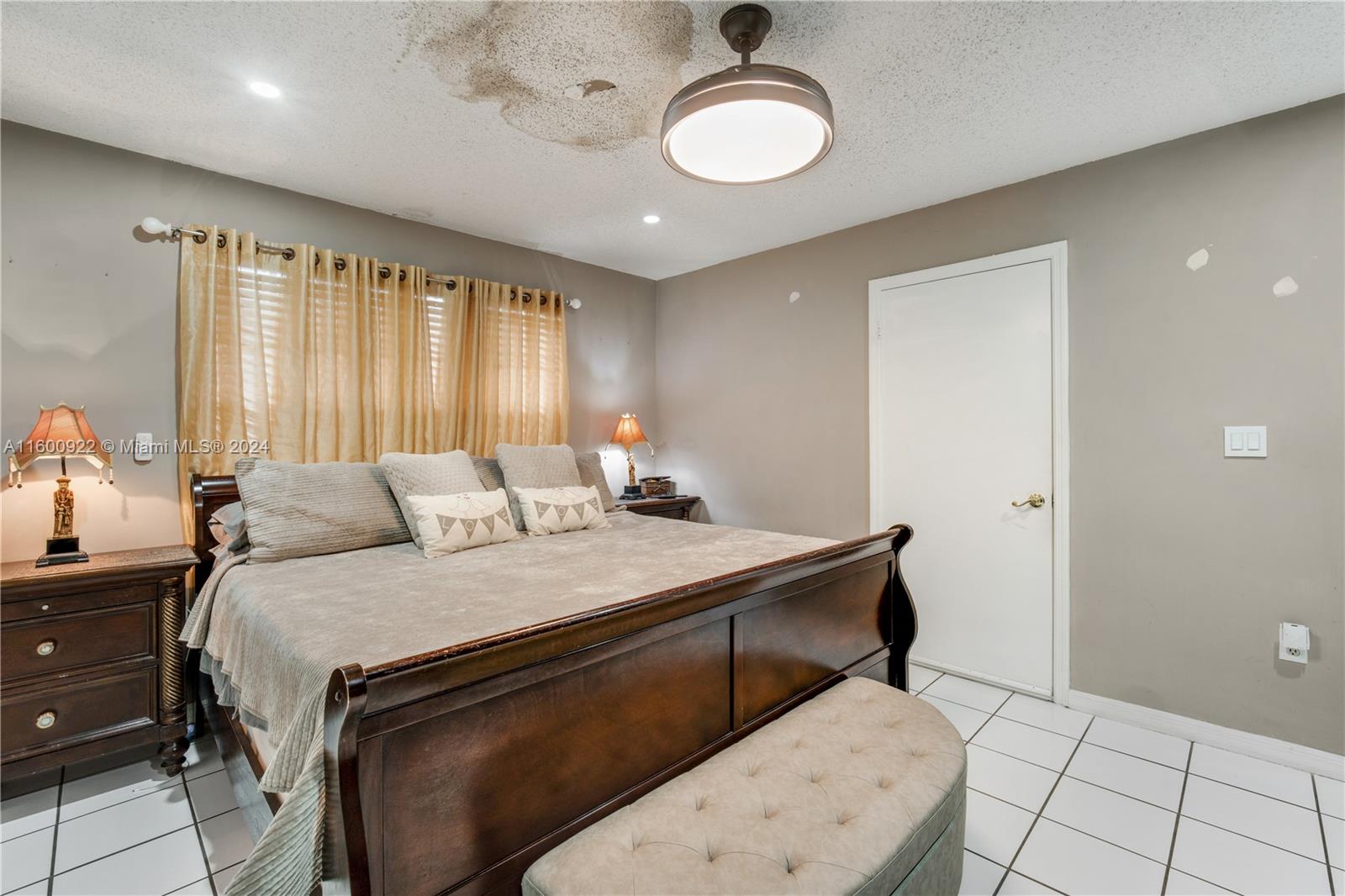 2245 Southwest 62nd Avenue Miami, FL 33155 - Photo 22 of 35 a bedroom with a bed and a chandelier