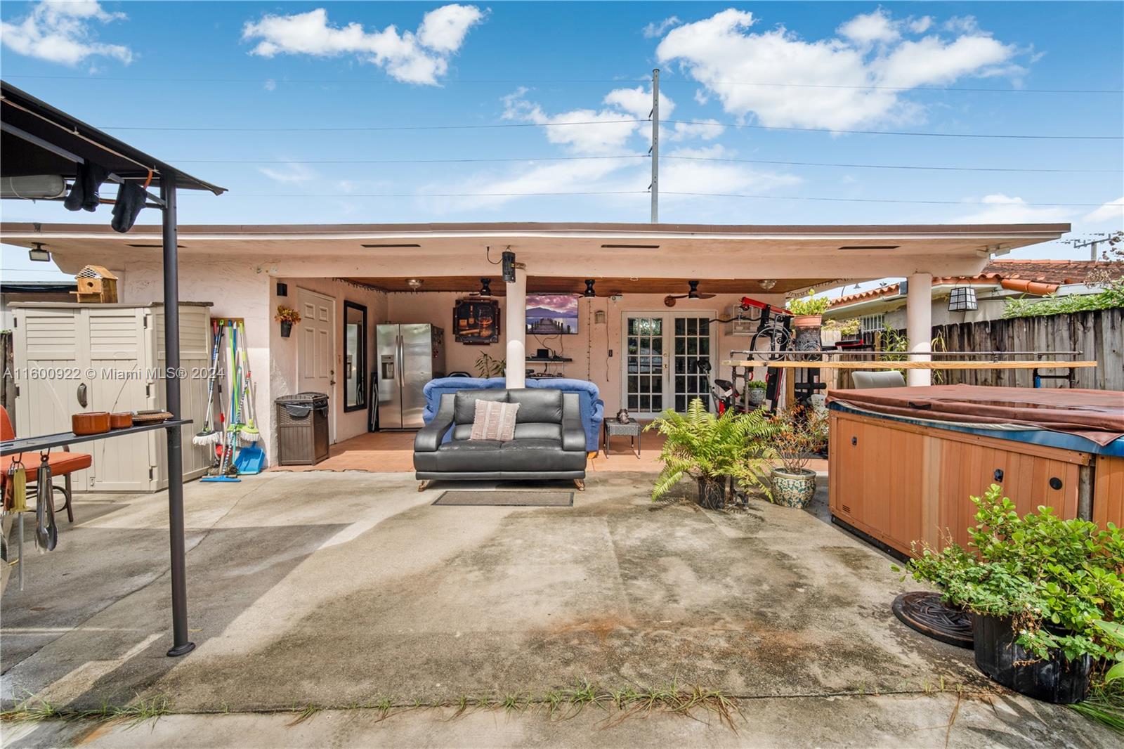 2245 Southwest 62nd Avenue Miami, FL 33155 - Photo 33 of 35 a living room with patio furniture and potted plants