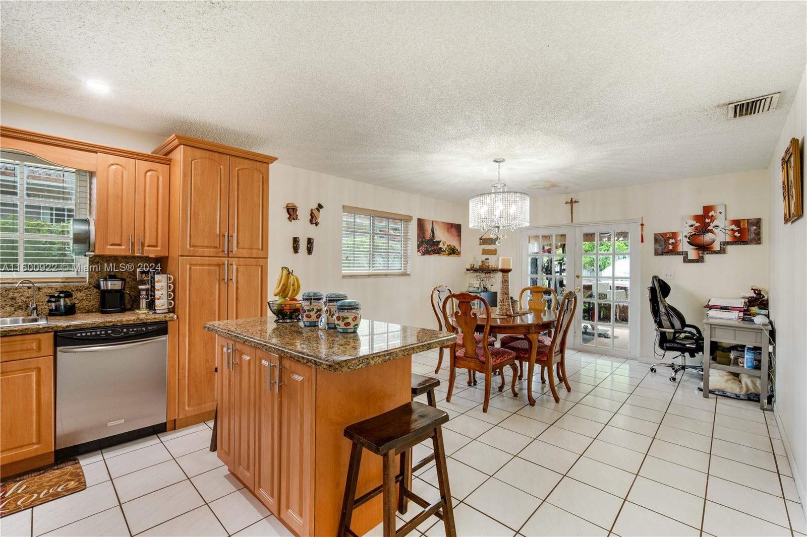 2245 Southwest 62nd Avenue Miami, FL 33155 - Photo 10 of 35 a view of a kitchen and dining room