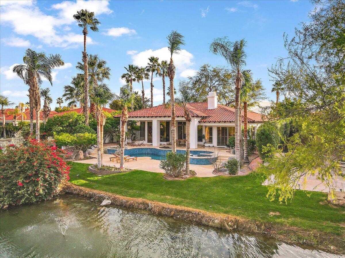 215 Loch Lomond Road Rancho Mirage, CA 92270 - Photo 1 of 57 a front view of a house with garden