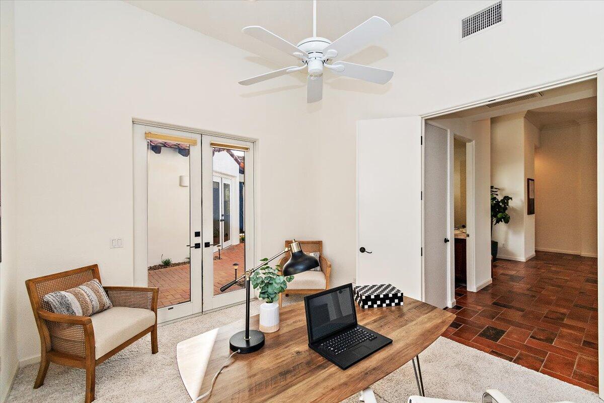 215 Loch Lomond Road Rancho Mirage, CA 92270 - Photo 18 of 57 a living room with furniture and wooden floor